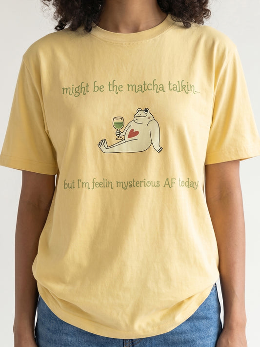 Person wearing a yellow t-shirt with a graphic and text on a plain background