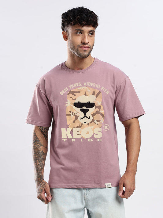 Man wearing a mauve t-shirt with a lion graphic and text on a white background