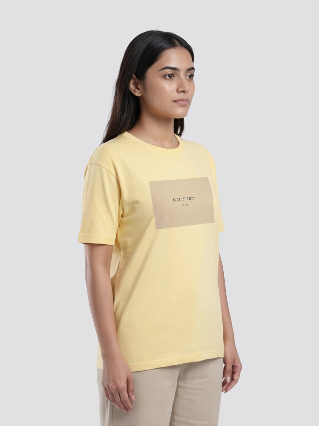 Woman wearing a yellow t-shirt with a logo on a white background