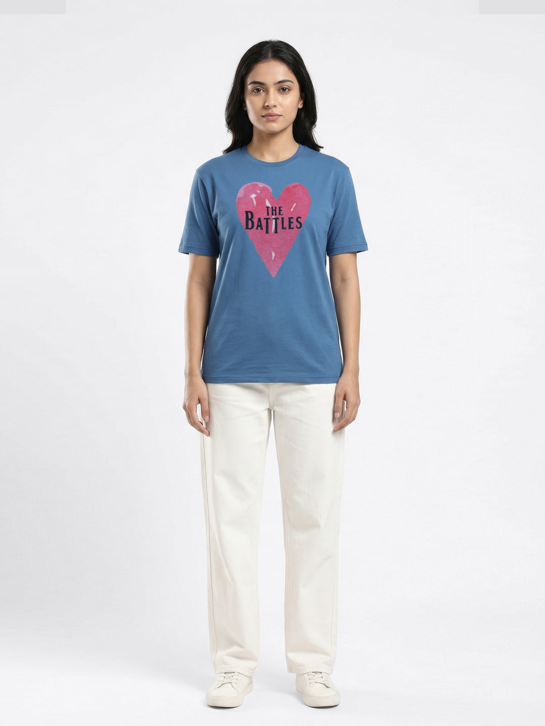 Person wearing a blue t-shirt with a pink heart graphic and text on a white background