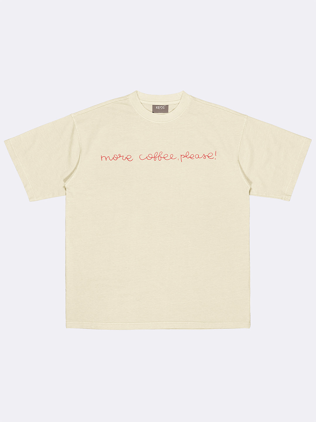 Beige t-shirt with 'more coffee please!' text on a white background