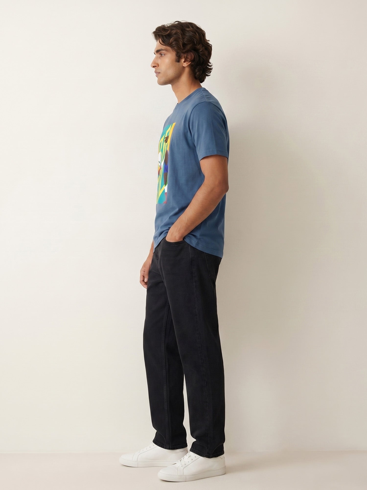Side facing of a man wearing blue printed t-shirt