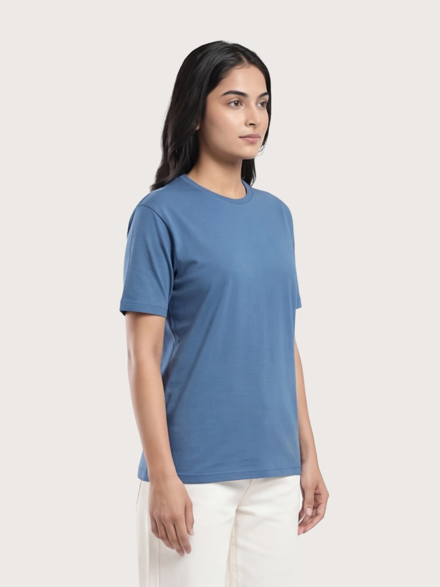 Woman wearing a blue t-shirt on a white background