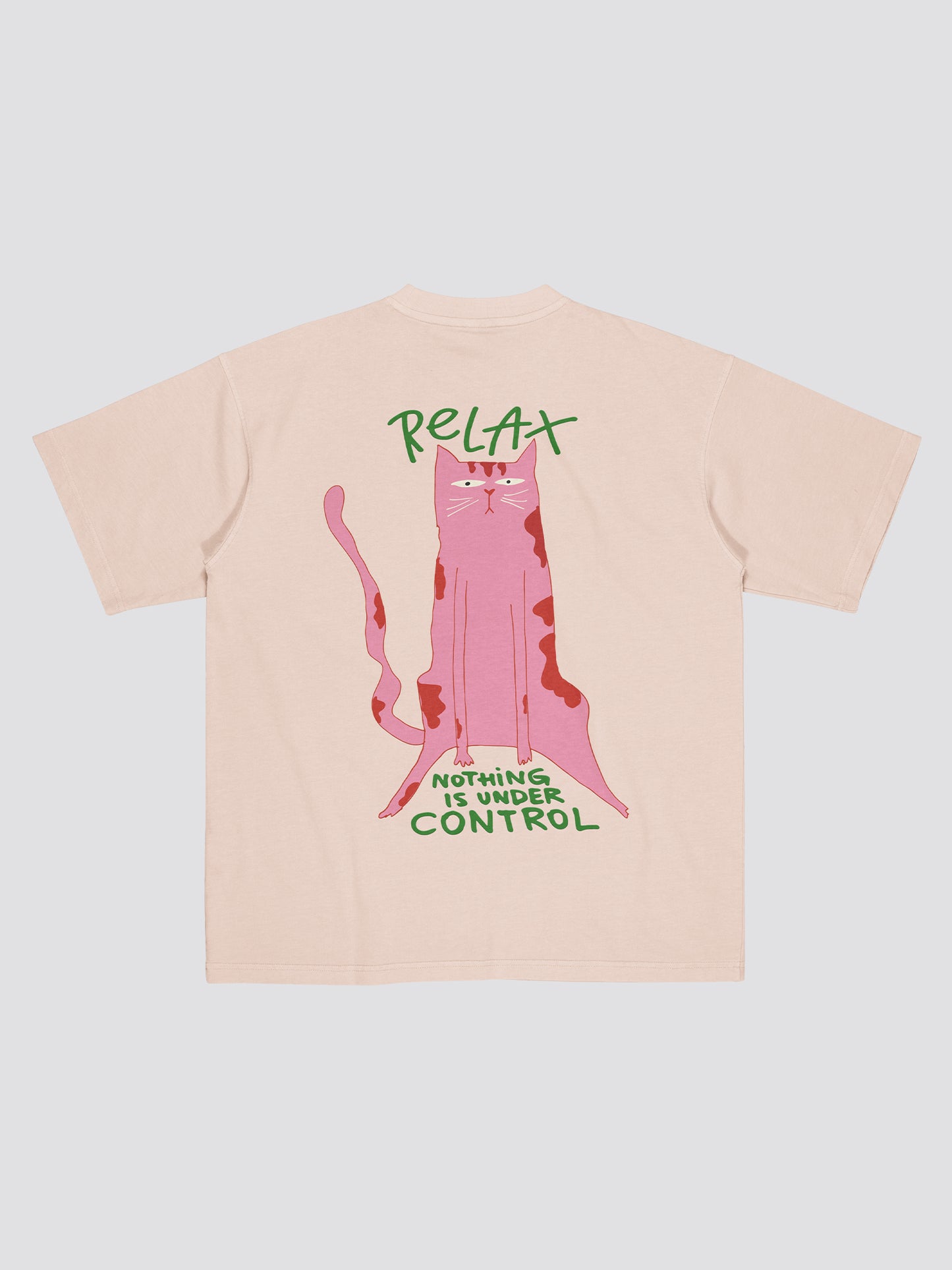 Beige t-shirt with a pink cat graphic and text on a light gray background