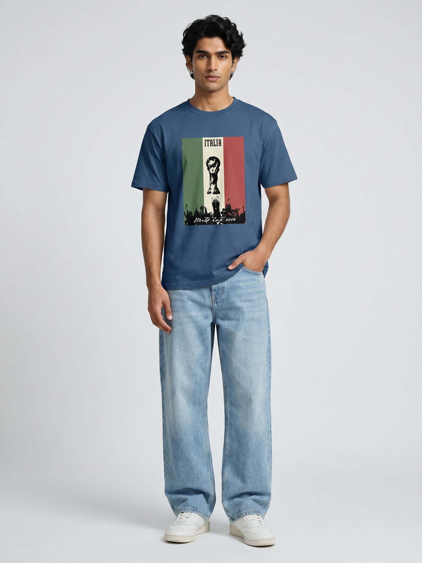 Man wearing a blue t-shirt with a graphic design with world cup on a plain background