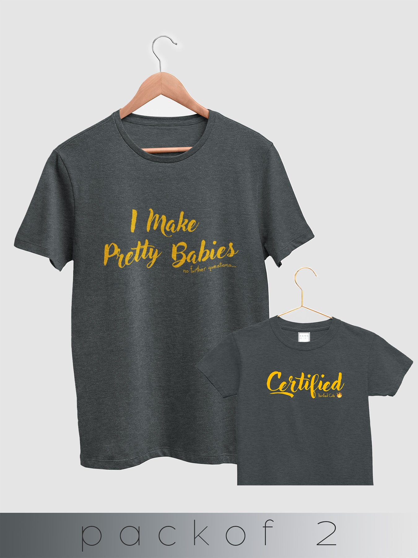 Two dark gray t-shirts with yellow text on hangers against a white background.