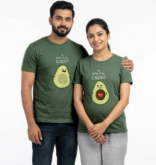 Man and woman wearing matching green t-shirts with avocado graphics on a white background