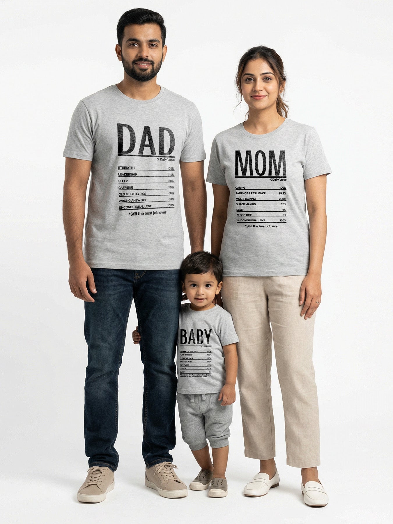 Family of three wearing matching t-shirts with 'DAD', 'MOM', and 'BABY' text on a white background