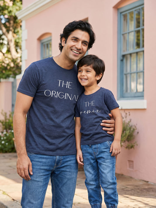 Father and child wearing matching navy blue t-shirts 