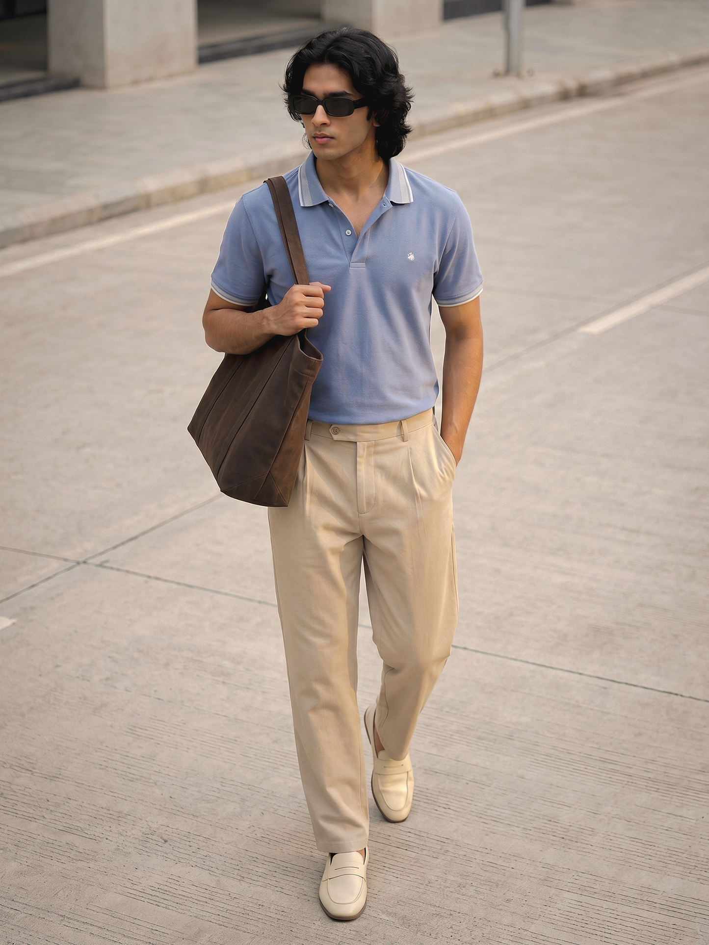Powder Blue Polo Shirt Keos premium cotton polo shirt in powder blue styled with tailored beige trousers and white loafers. Sophisticated men’s fashion look inspired by old money style, quiet luxury, business casual dressing, resort wear, summer menswear and modern urban fashion.

