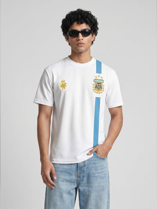 Person wearing a white t-shirt with a Argentina Messi jersey blue stripe and logo, standing against a plain background