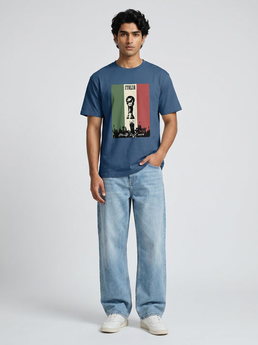Man wearing a blue t-shirt with a graphic design with world cup on a plain background