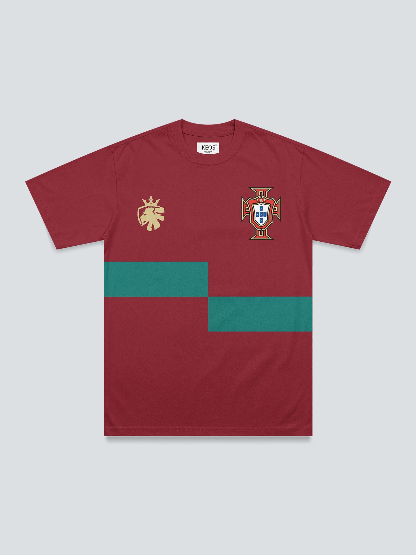Red t-shirt with green stripes and logos on a light gray background